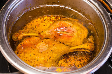 Traditional slow cooked duck confit in the pot
