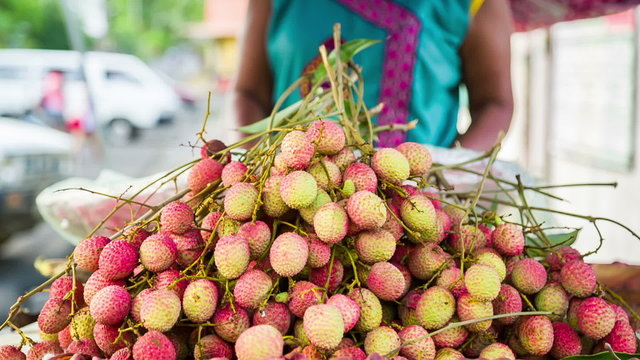 Lychee fruit pile in outdoor market