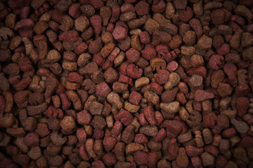 Dry food for animals broken up in the background
