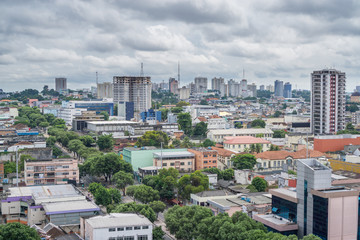 Fototapeta premium Colorful houses, cloudy sky in Manaus, Brazil