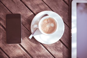cup of coffe tablet and smart phone