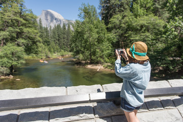 girl taking picture half dome, Yosemite National Park