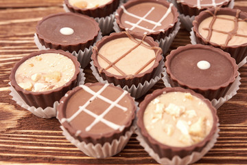 Dark chocolate on wooden background