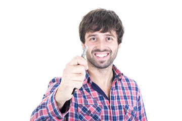 Smiling man offering house key.