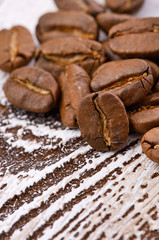Coffee beans on wood background