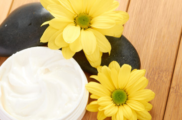 Naklejka na ściany i meble cosmetic cream with herbal flower