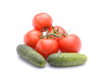Tomatoes and cucumber isolated on white background