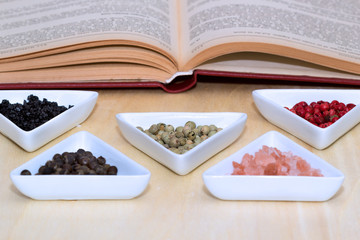Variety of peppercorns and salt