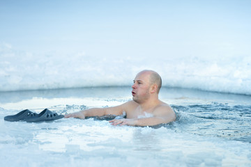 Traditional Russian  winter recreation  swimming in the ice-hole