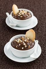 chocolate mousse with biscuits in cups