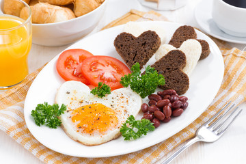 fried eggs in the form of heart for breakfast Valentine's Day