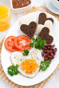 fried eggs in the form of heart for breakfast Valentine's Day