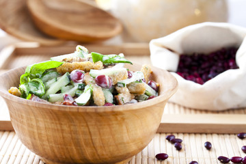 salad with beans, bacon, cucumber and croutons