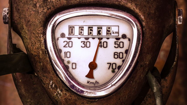 Moving Needle On Speedometer Of Grungy Scooter Or Moped
