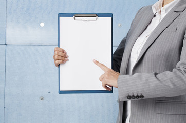 Businesswoman holding a clipboard