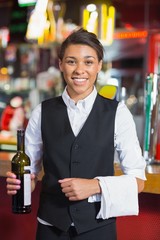 Pretty barmaid smiling at camera