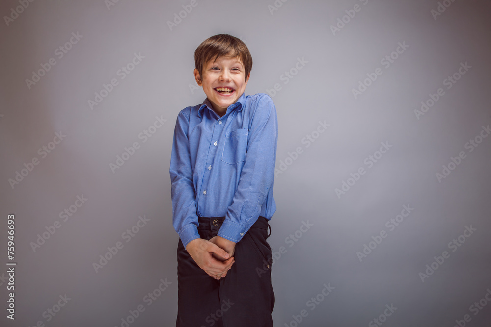 Wall mural teenager boy brown hair European appearance laughing and looking