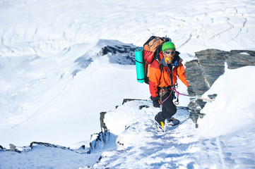 Fototapeta na wymiar Climber on the snowy mountains