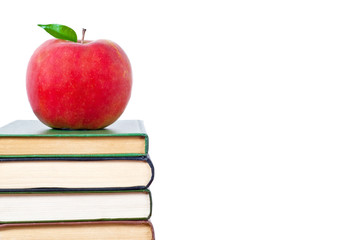 Apple and books on a white background