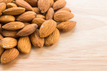 Almond on wooden background