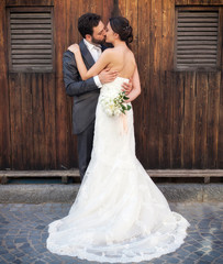 Married couple near wooden cabins