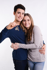 portrait of successful young couple showing their house keys