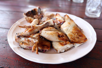 Grilled chicken in dish.