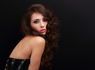 Fototapeta premium Beautiful makeup woman with curly long brown hair looking