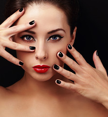 Sexy fashion model with bright makeup and black manicure