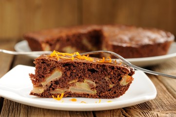 Chocolate apple cake on wooden background