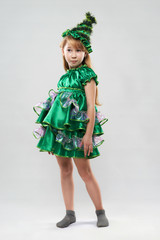  red-haired girl in a suit of Christmas trees