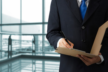 Businessman signing a document