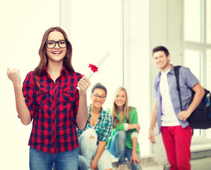 smiling female student in eyeglasses with diploma