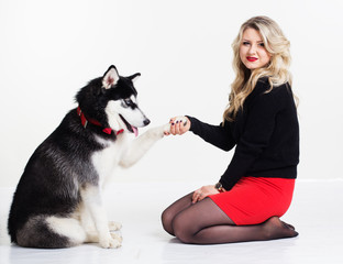 Young girl with her husky dog isolated on white © _chupacabra_