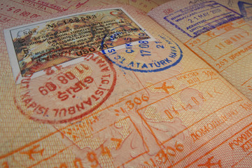 Passport page with Turkey visa and immigration control stamps.