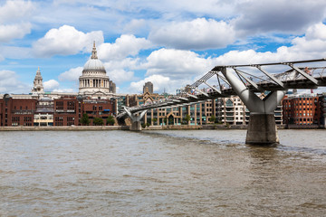 Fototapeta na wymiar LONDON - AUGUST 3: St Paul's Cathedral and Millennium Bridge on