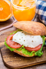 Burger with pouched egg and tomato