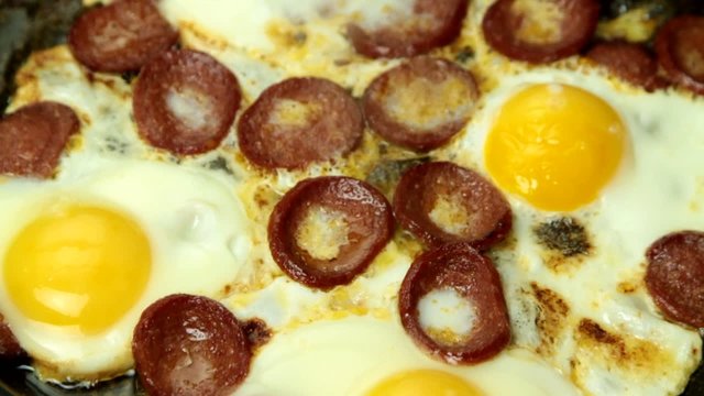 Turkish cuisine fried egg and sausage.  ( hd video with sound )