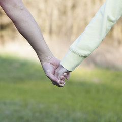 boy and girl holding hands