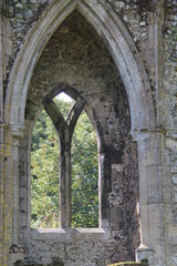 Fototapeta na wymiar A Stone Built Arch Window in an Ancient Building.