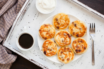 Delicious homemade cheese pancakes with coffee