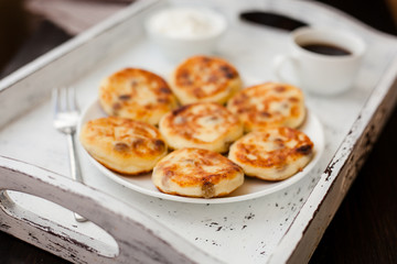 Delicious homemade cheese pancakes with coffee
