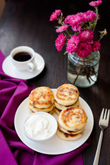 Delicious homemade cheese pancakes with black coffee
