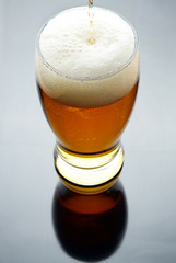 Pouring beer into glass