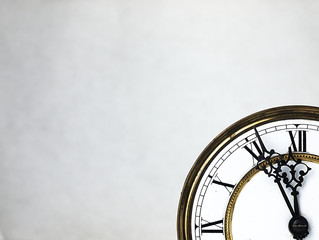 Old clock with roman numerals.
