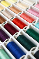 Multicolored sewing threads background