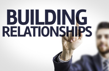 Business man pointing the text: Building Relationships
