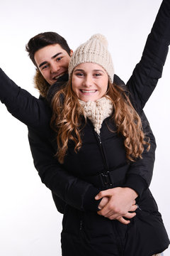 Isolated Studio Portrait Of Young Couple In Winter Outfit