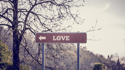 Signpost with pointing arrow towards Love