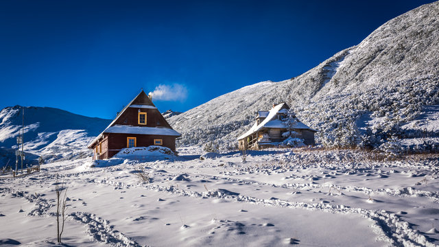 Wooden houses in winter mountains